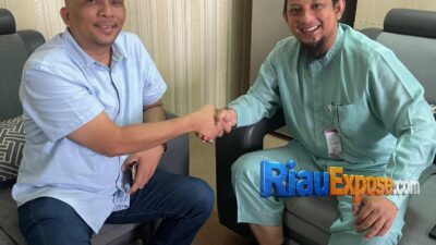 Kepala Dinas Pendidikan (Kadisdik) Kota Pekanbaru, Dr. Syafrian Tommy, S.STP., M.Si menerima kunjungan DANKOTI MPC Pemuda Pancasila Kota Pekanbaru, Heri Bukit